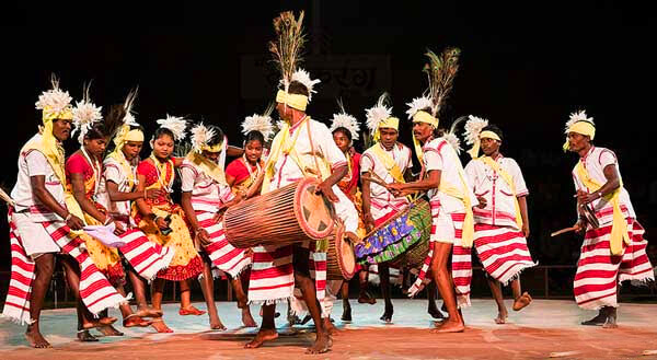Banjara women wearing traditional Lambadi dress with jewelry and mirror work during a cultural performance